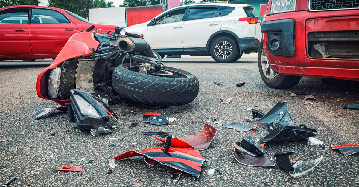 car crash and motorcycle on the road