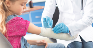 doctor bandaging a child
