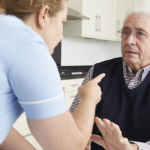 care worker mistreating elderly man