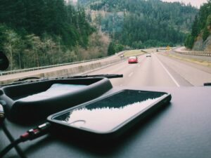 smartphone on the dash of a car, driving in upstate New York