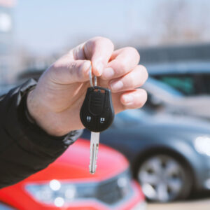 a man holding car keys