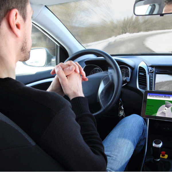 man with an autonomous driving vehicle