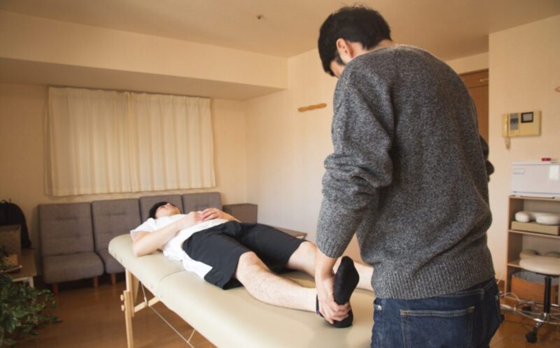 man administering physical therapy to a car accident victim in new york