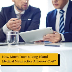 two long island medical malpractice attorneys reviewing contingency fees