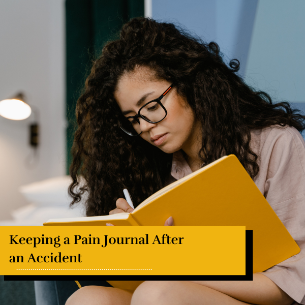 woman writing in pain journal to keep track of her symptoms after an accident