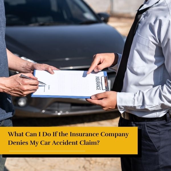 Insurance agent at a car accident scene