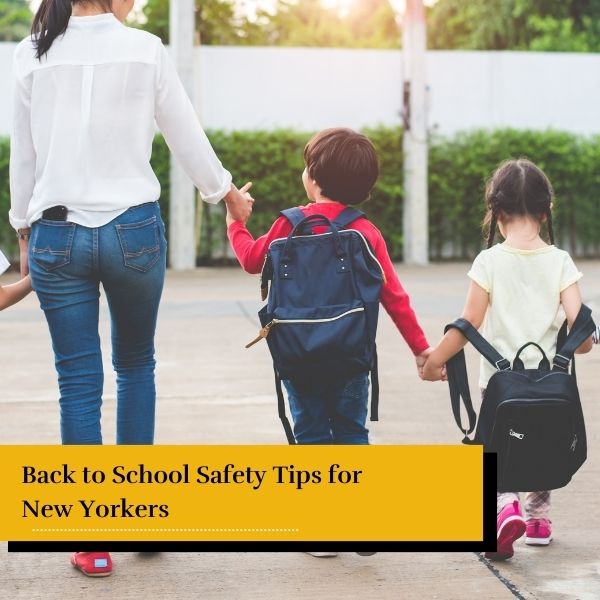 mom walking her children to school - back to school safety tips