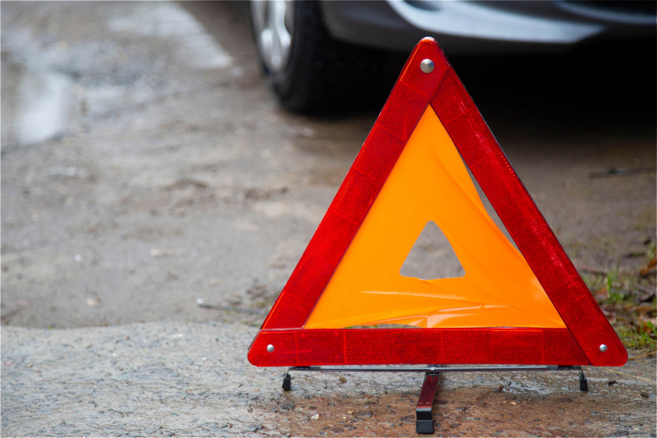 Warning triangle at the scene of a car accident