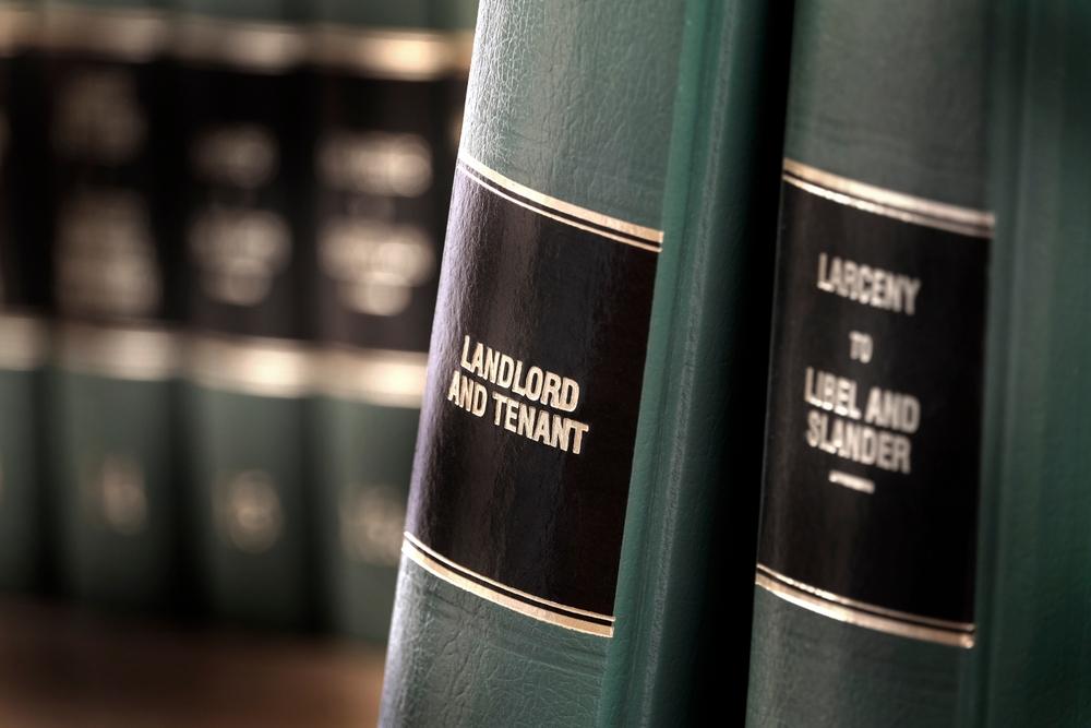 Law books labeled Landlord and Tenant, representing property owner negligence in Brooklyn premises liability cases