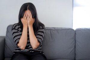 Woman experiencing emotional distress after a traumatic event