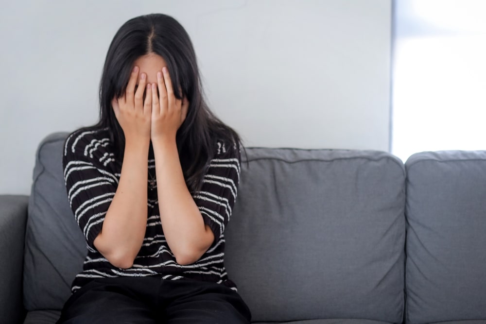 Woman experiencing emotional distress after a traumatic event
