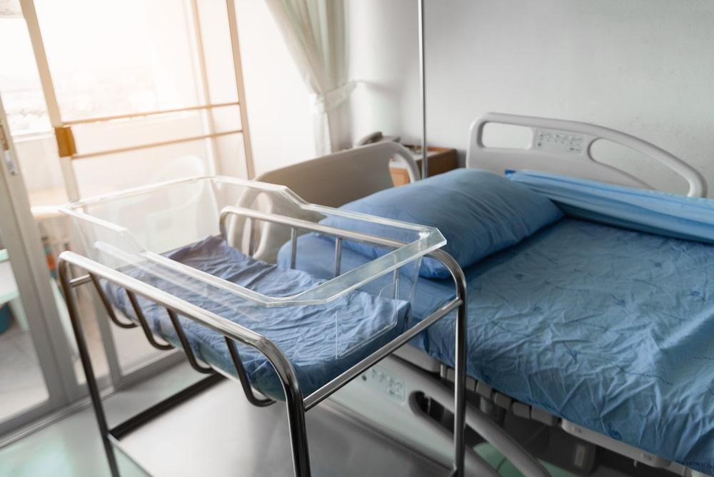Hospital room with an empty patient bed